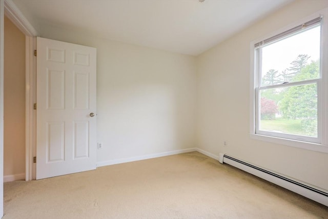 37 Annetta Rd, Ashland, MA 01721 - spare room featuring a baseboard heating unit, light carpet, and baseboards