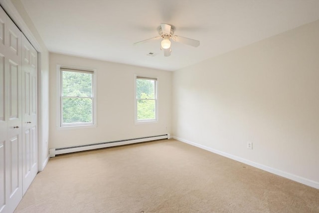 37 Annetta Rd, Ashland, MA 01721 - unfurnished bedroom with a baseboard radiator, light carpet, a closet, and baseboards