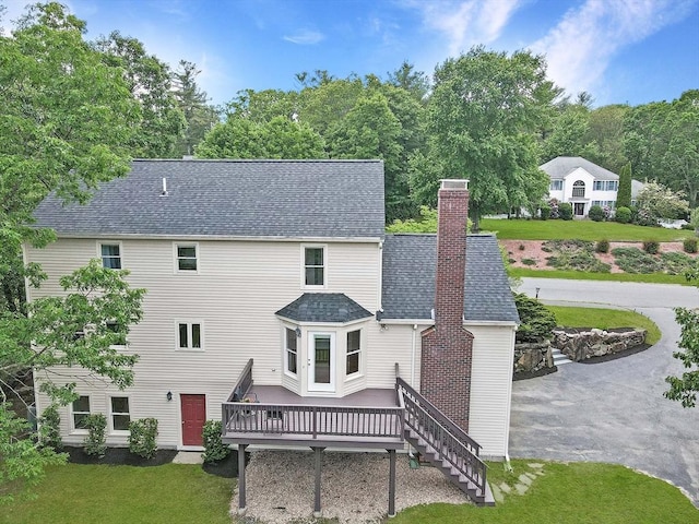 37 Annetta Rd, Ashland, MA 01721 - back of house with a wooden deck, a chimney, a yard, roof with shingles, and stairs
