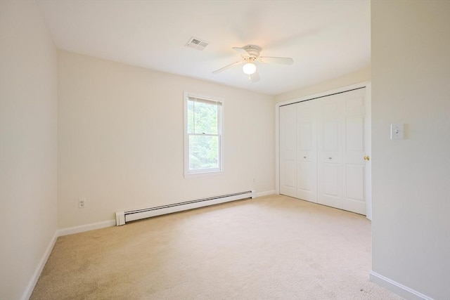 37 Annetta Rd, Ashland, MA 01721 - unfurnished bedroom with a baseboard radiator, light colored carpet, baseboards, and a closet