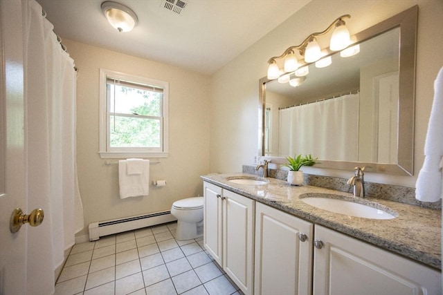 37 Annetta Rd, Ashland, MA 01721 - full bathroom featuring baseboard heating, double vanity, tile patterned floors, toilet, and baseboards