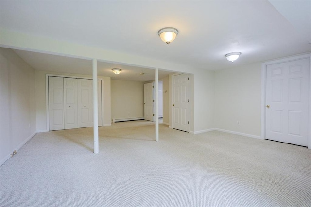 37 Annetta Rd, Ashland, MA 01721 - finished basement featuring light carpet, a baseboard radiator, and baseboards