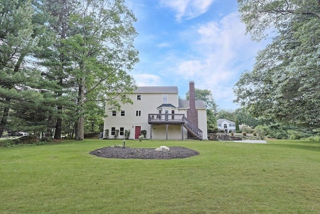 37 Annetta Rd, Ashland, MA 01721 - rear view of house featuring stairway, a chimney, a yard, and a wooden deck