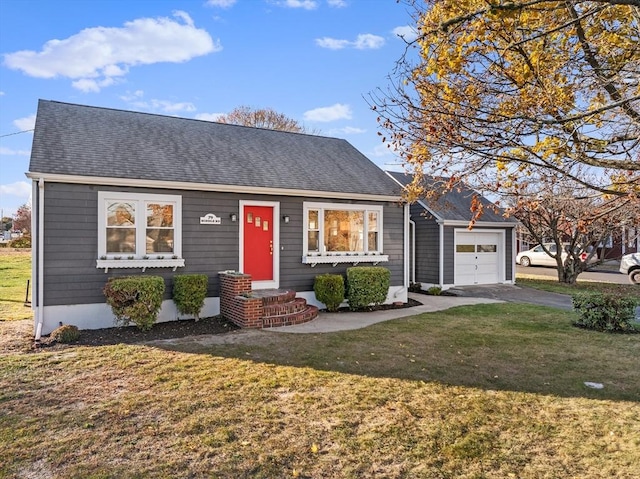 view of front of home with an attached garage, a front yard, asphalt driveway, and roof with shingles