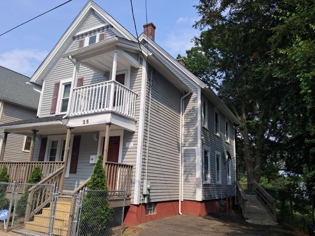 25 Clifton Ave, Springfield, MA 01105 - view of front of home featuring a balcony, a porch, and a chimney