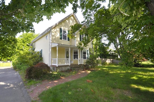 446 Elm St, East Bridgewater, MA 02333 - view of front of property with covered porch and a front yard