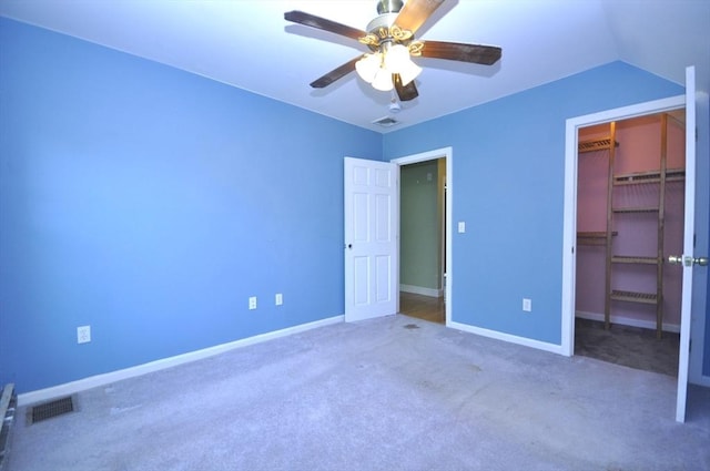 446 Elm St, East Bridgewater, MA 02333 - unfurnished bedroom featuring carpet, a spacious closet, a closet, and a ceiling fan