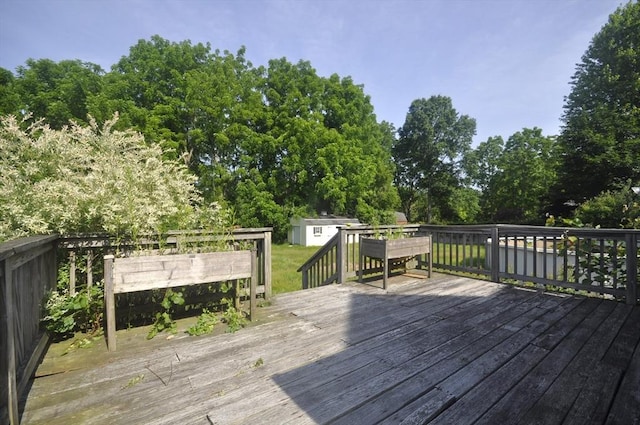 446 Elm St, East Bridgewater, MA 02333 - wooden deck with a storage shed and view of wooded area