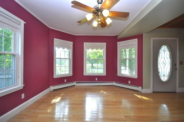 446 Elm St, East Bridgewater, MA 02333 - entrance foyer with light wood-style flooring, crown molding, and ceiling fan