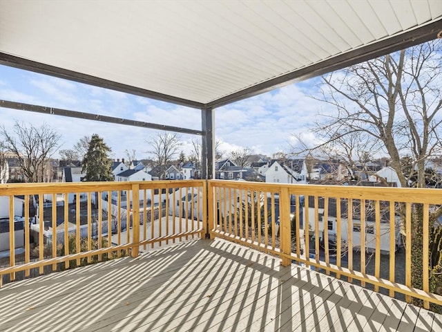 wooden terrace featuring a residential view