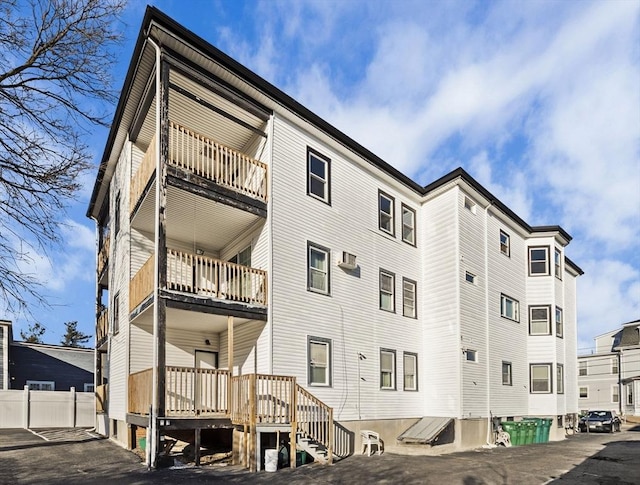 view of building exterior featuring an AC wall unit