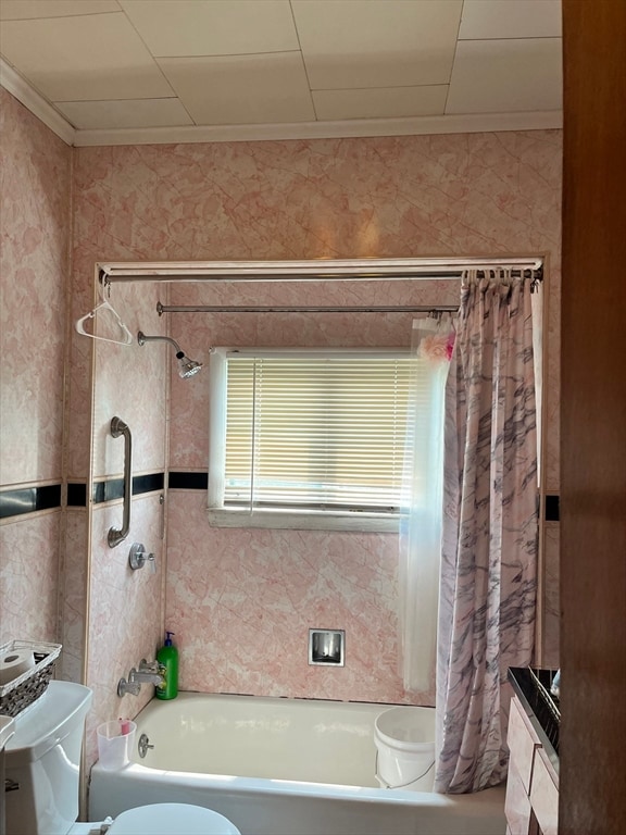 bathroom featuring shower / tub combo with curtain and toilet