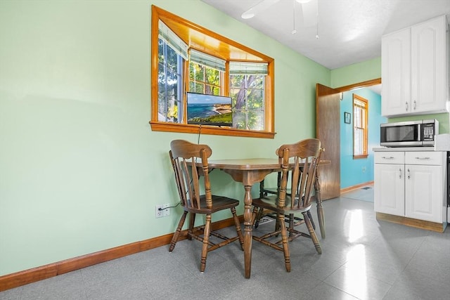 dining room featuring ceiling fan