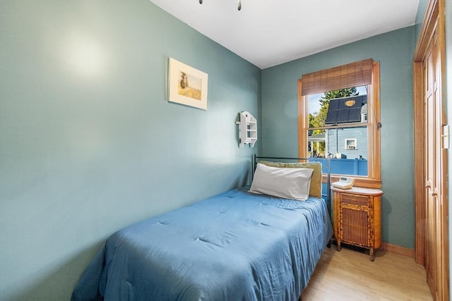 bedroom with light hardwood / wood-style flooring