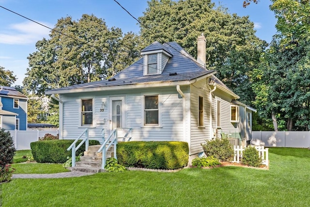 bungalow with a front yard