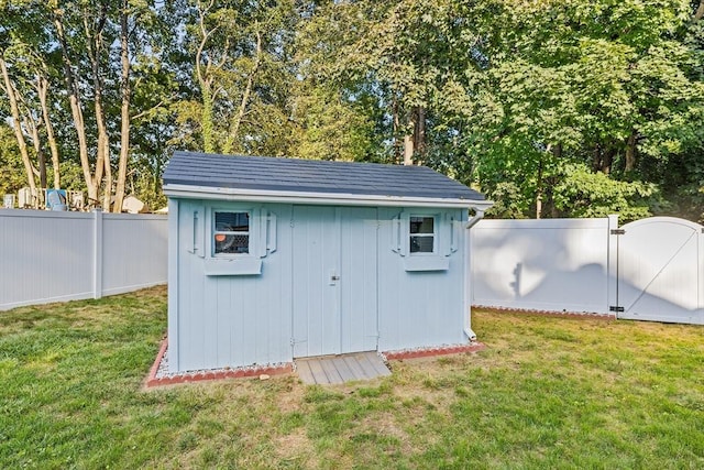 view of outbuilding with a lawn