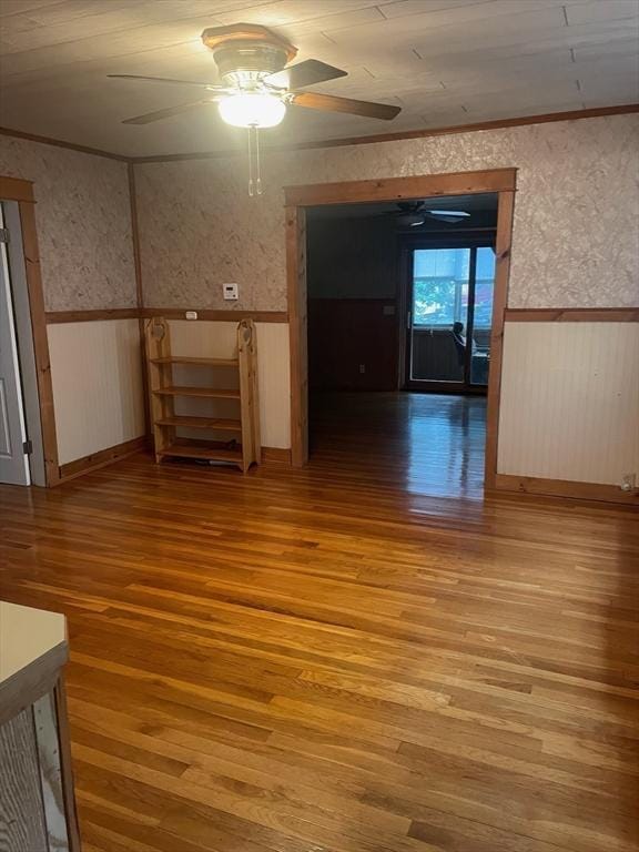 unfurnished room featuring hardwood / wood-style flooring and ceiling fan