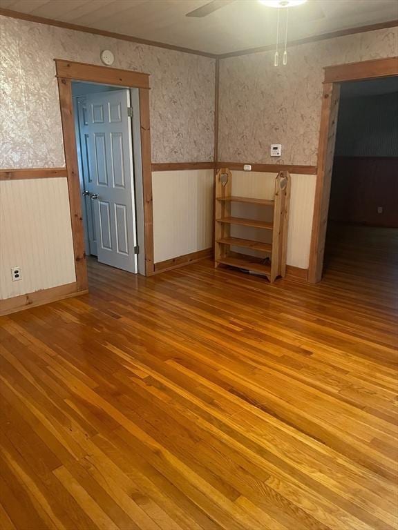 unfurnished room with hardwood / wood-style flooring and ceiling fan