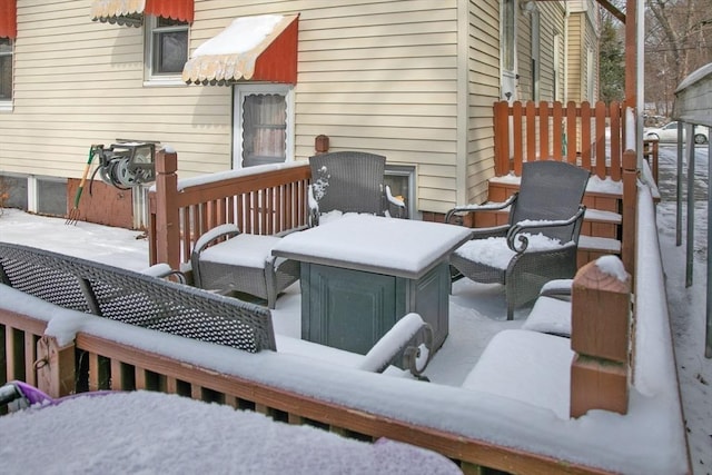 view of snow covered deck