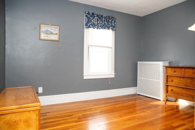 unfurnished bedroom featuring hardwood / wood-style flooring