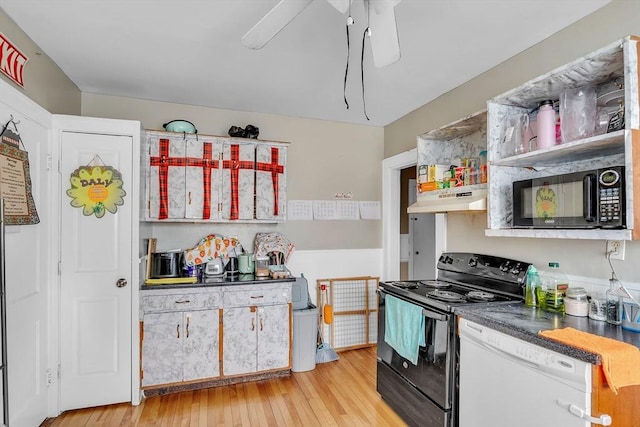 kitchen with light hardwood / wood-style flooring and black appliances