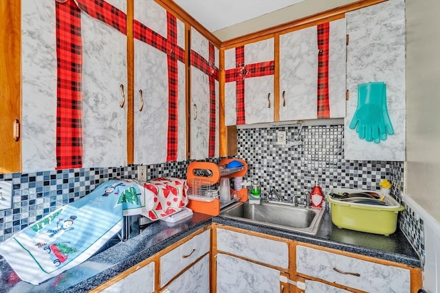 kitchen featuring tasteful backsplash and sink