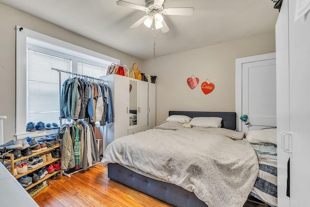 bedroom featuring hardwood / wood-style flooring and ceiling fan