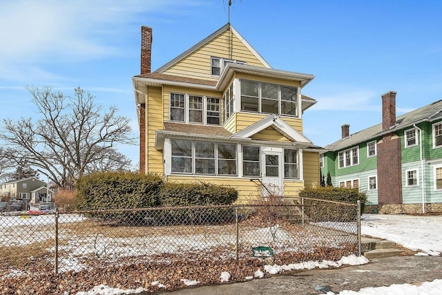 view of front of house with a sunroom