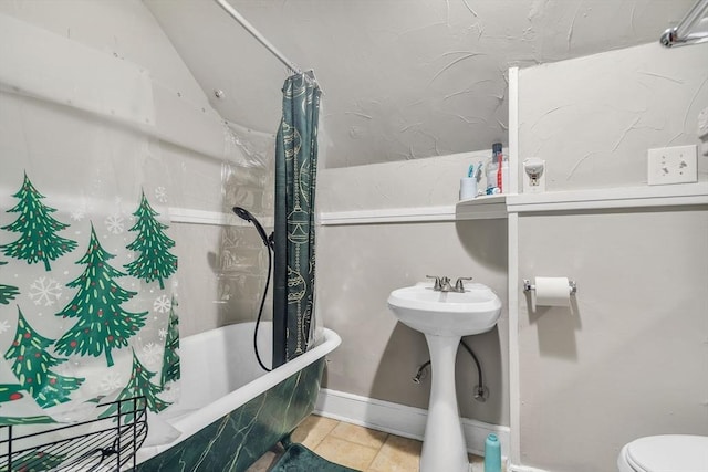 full bathroom featuring shower / bath combo, sink, and toilet