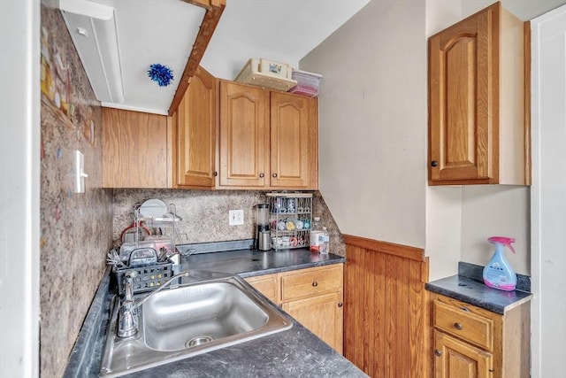 kitchen featuring tasteful backsplash and sink