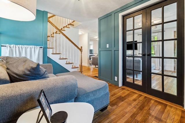 17 Atwood Ave, Millbury, MA 01527 - living area featuring hardwood / wood-style floors, french doors, and stairway
