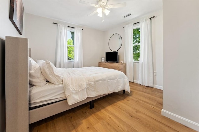 17 Atwood Ave, Millbury, MA 01527 - bedroom with multiple windows, light wood-style flooring, baseboards, and a ceiling fan
