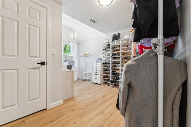17 Atwood Ave, Millbury, MA 01527 - spacious closet with light wood-style floors, a chandelier, and lofted ceiling