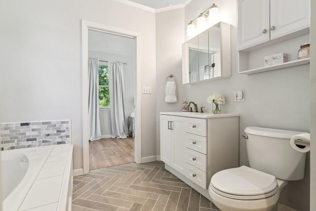 17 Atwood Ave, Millbury, MA 01527 - full bath featuring toilet, a garden tub, vanity, baseboards, and crown molding