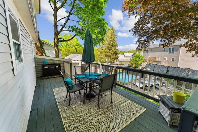 17 Atwood Ave, Millbury, MA 01527 - wooden deck featuring outdoor dining area, fence, and a residential view