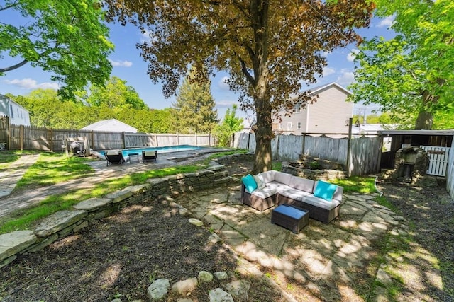 17 Atwood Ave, Millbury, MA 01527 - fenced backyard with an outdoor living space and a patio