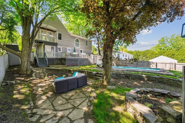 17 Atwood Ave, Millbury, MA 01527 - fenced backyard with a balcony, an outdoor living space, stairway, a deck, and a patio area