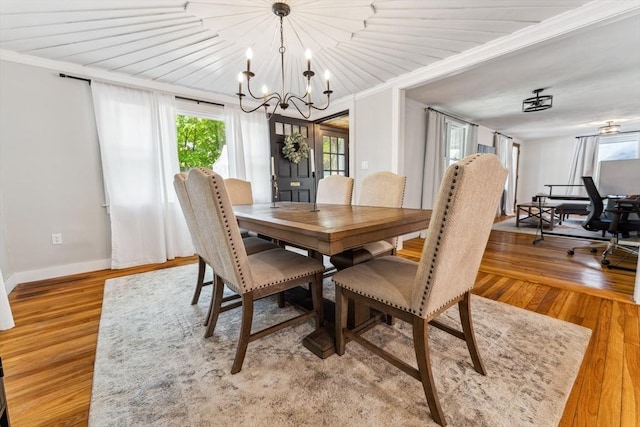 17 Atwood Ave, Millbury, MA 01527 - dining area featuring ornamental molding, a chandelier, baseboards, and wood finished floors