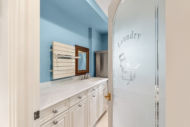 bathroom featuring vanity, tile patterned floors, and radiator heating unit