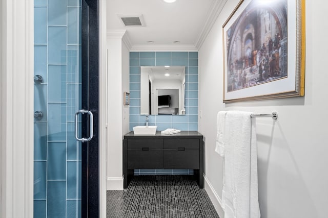 bathroom featuring tile walls, vanity, crown molding, and walk in shower