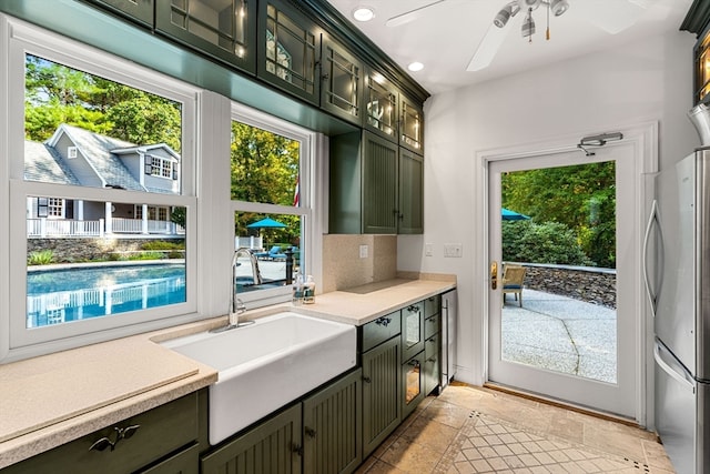 interior space featuring sink and ceiling fan