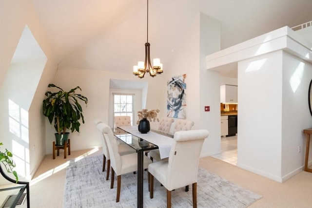 dining area featuring a notable chandelier, light colored carpet, and a high ceiling