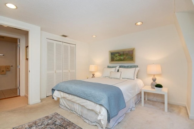 carpeted bedroom featuring a closet