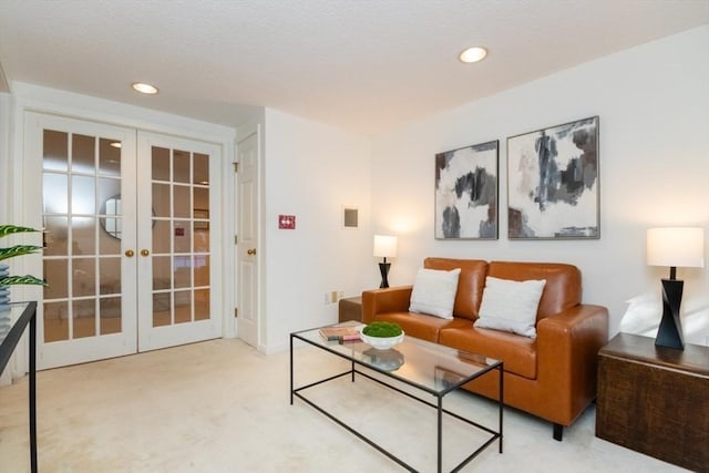 living room featuring french doors and carpet