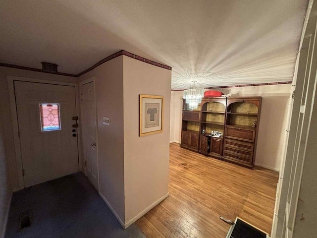 27 Hilton Ter, Boston, MA 02119 - corridor with a chandelier, light wood-style floors, and crown molding