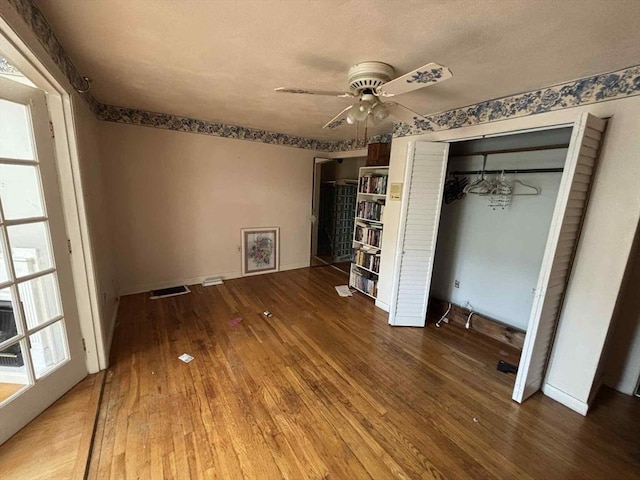 27 Hilton Ter, Boston, MA 02119 - unfurnished bedroom with wood-type flooring, ceiling fan, and a closet