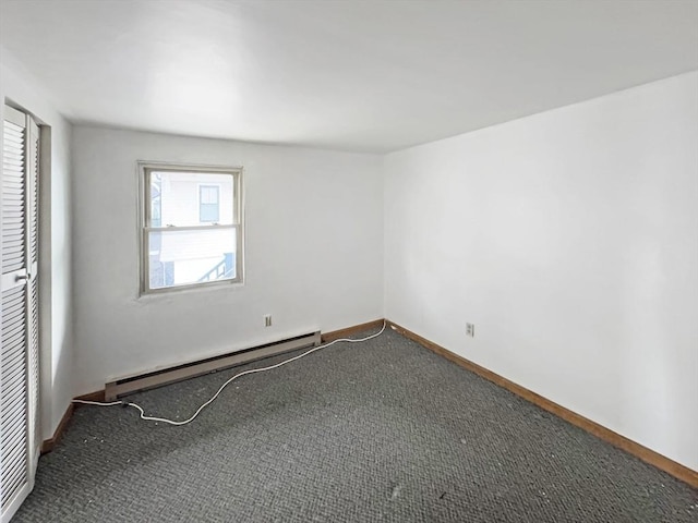498 N End Blvd, Salisbury, MA 01952 - empty room with a baseboard radiator and carpet flooring