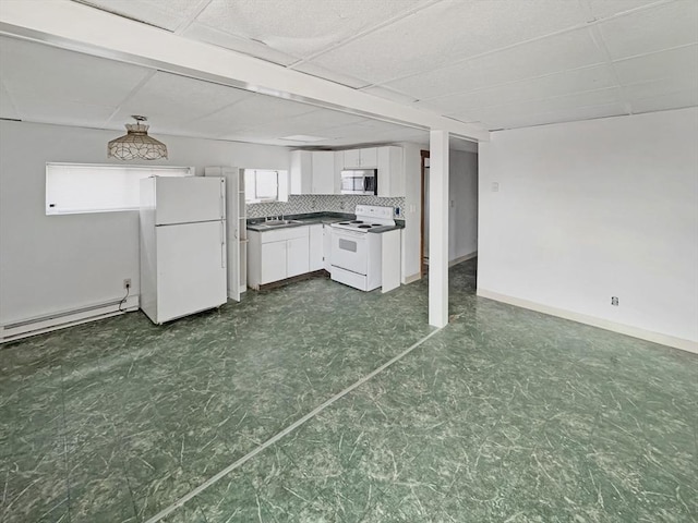 498 N End Blvd, Salisbury, MA 01952 - kitchen with white appliances, white cabinetry, a baseboard heating unit, dark floors, and dark countertops
