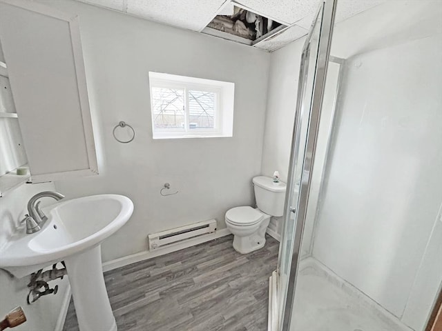 498 N End Blvd, Salisbury, MA 01952 - full bathroom with a baseboard radiator, a shower stall, and wood finished floors