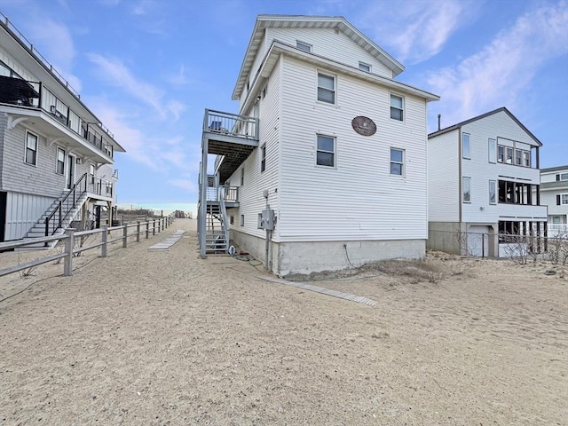 498 N End Blvd, Salisbury, MA 01952 - view of side of property featuring stairway and a balcony